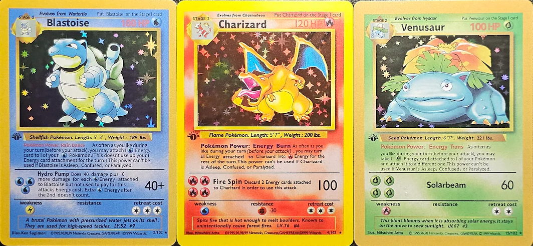 Blastoise, Charizard, and Venusaur trading cards